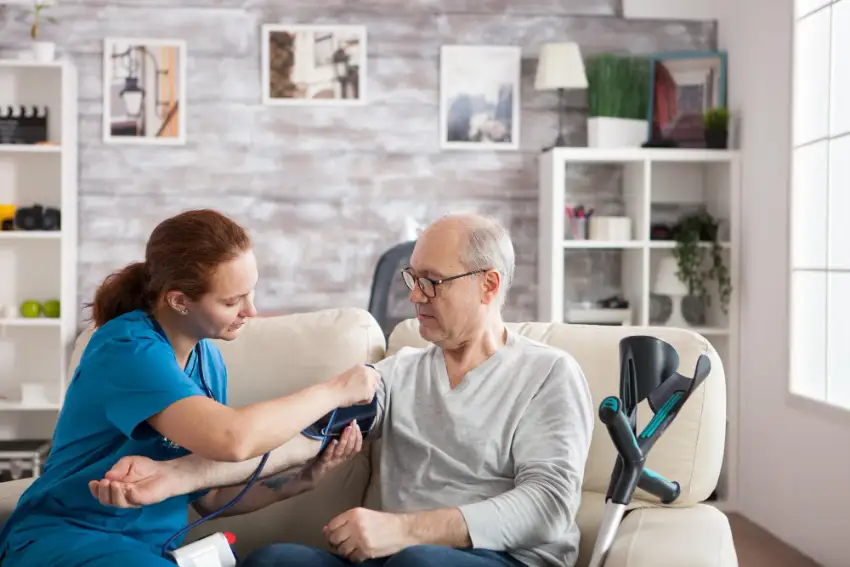 A Primary Care Physician checking the BP of a patient