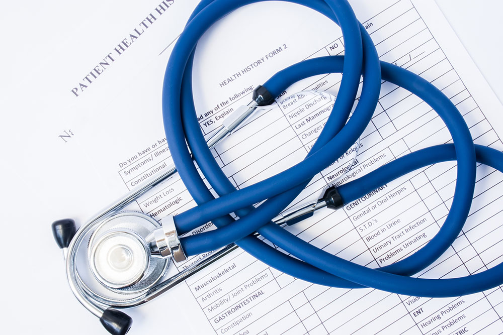 Paper,Form,Patient History and Stethoscope,On a table