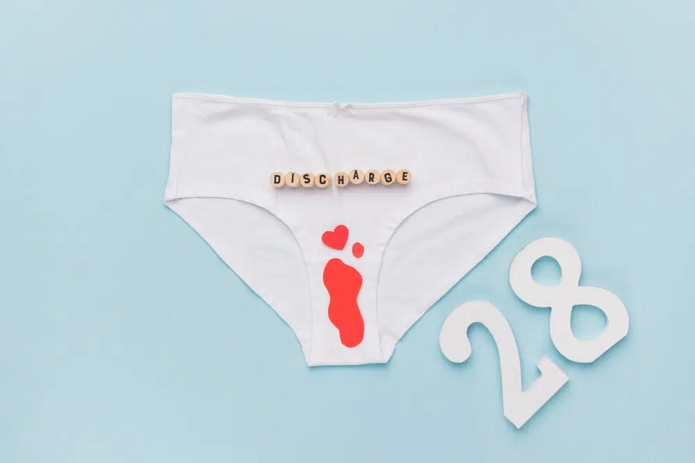 Medical professional discussing vaginal infection symptoms and treatment options in Katy, TX.