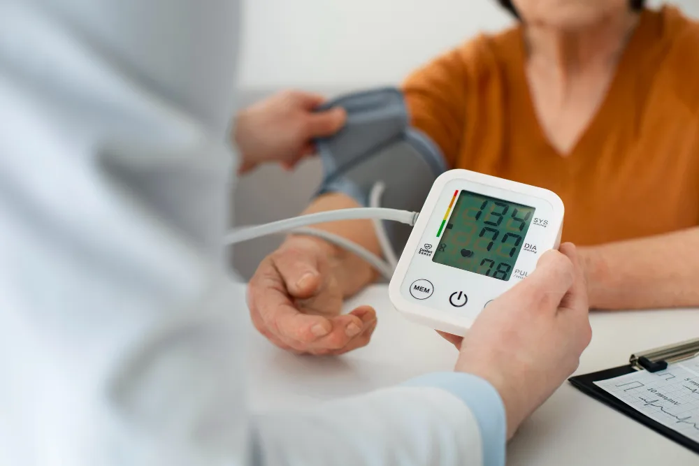 A doctor checking the blood pressure of a patient