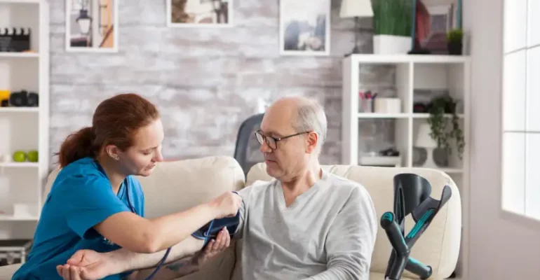 A Primary Care Physician checking the BP of a patient