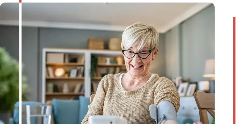 An elderly woman checking her blood pressure