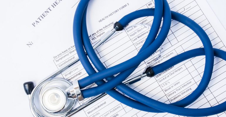 Paper,Form,Patient History and Stethoscope,On a table